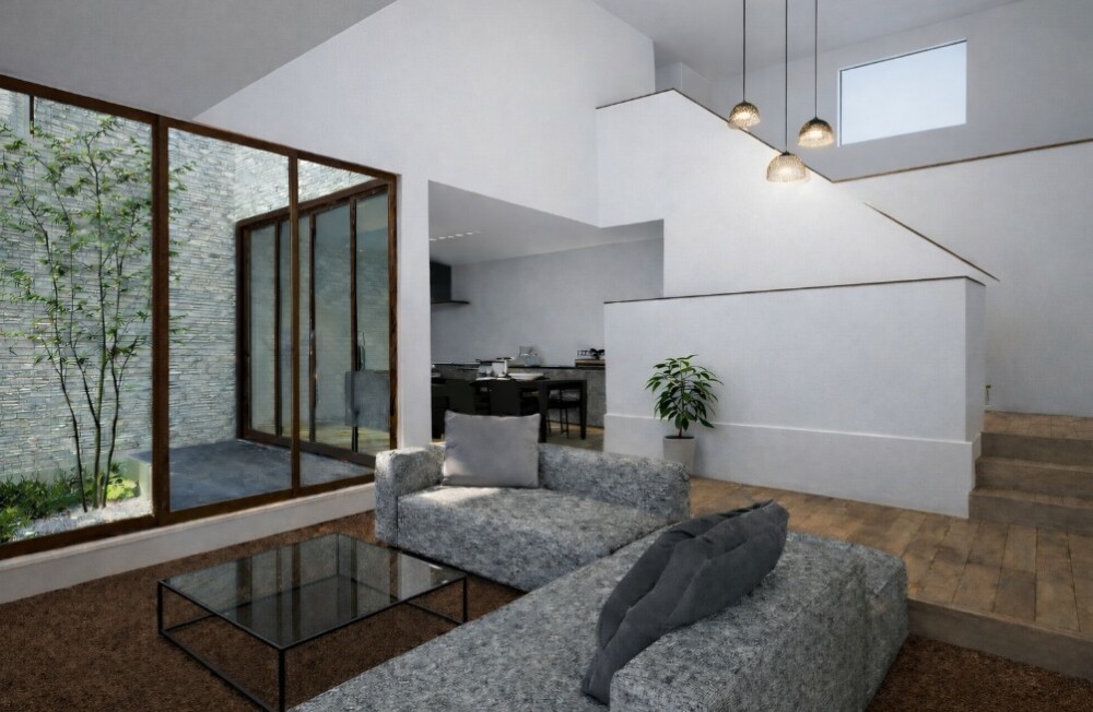 和モダンの住宅におけるスキップフロアのあるリビング空間。段差と階段途中の中間領域が、視線と距離感をやわらかく分節し、中庭からの光と奥行きが心地よい余白を生み出す建築家設計の住まい。